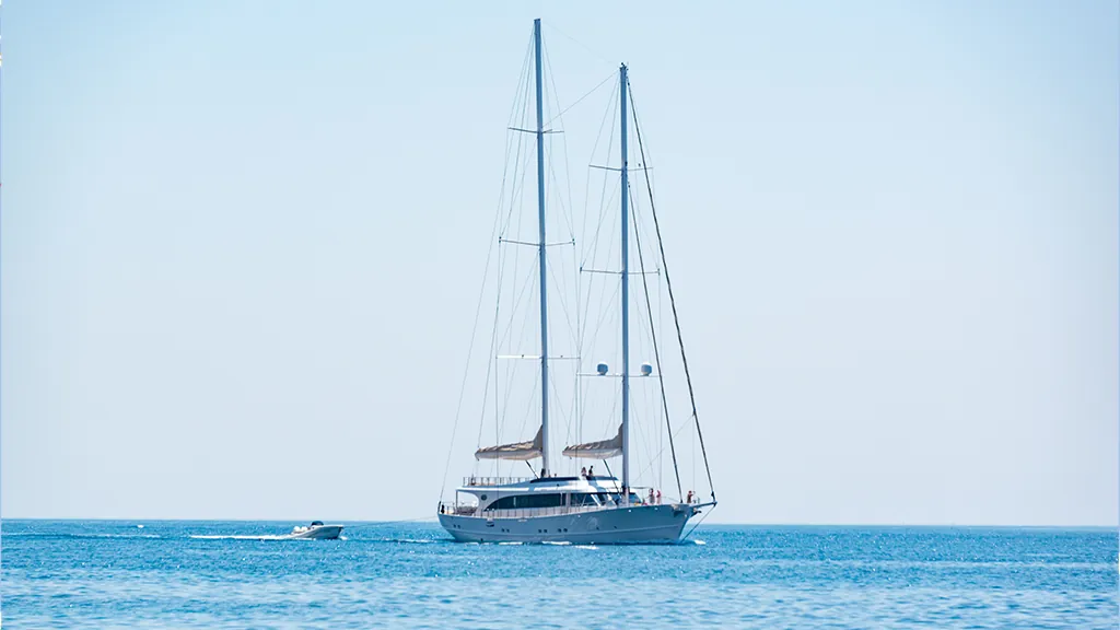Two-masted sailing yacht at sea