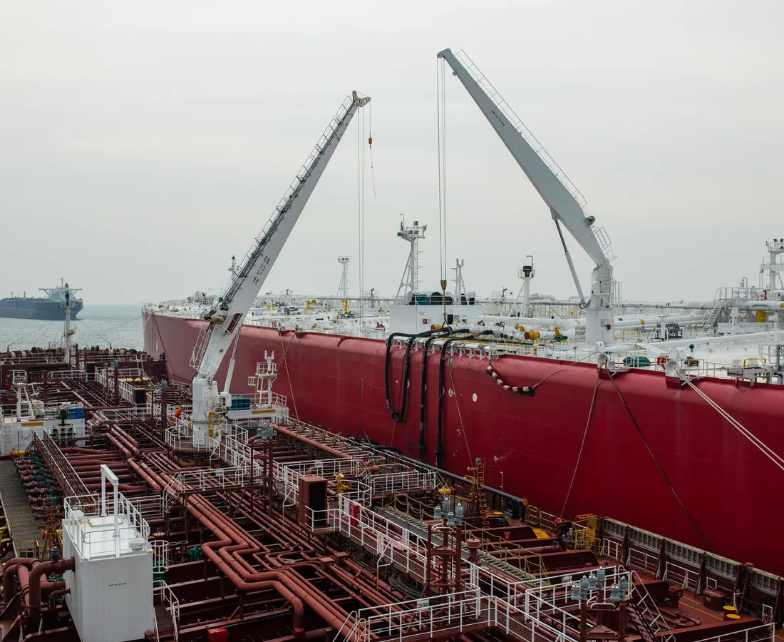 Tanker deck cranes working alongside a second tanker
